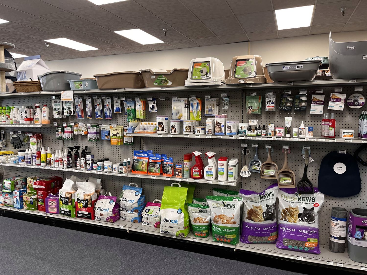 Shelves of small-pet food, litter and accessories